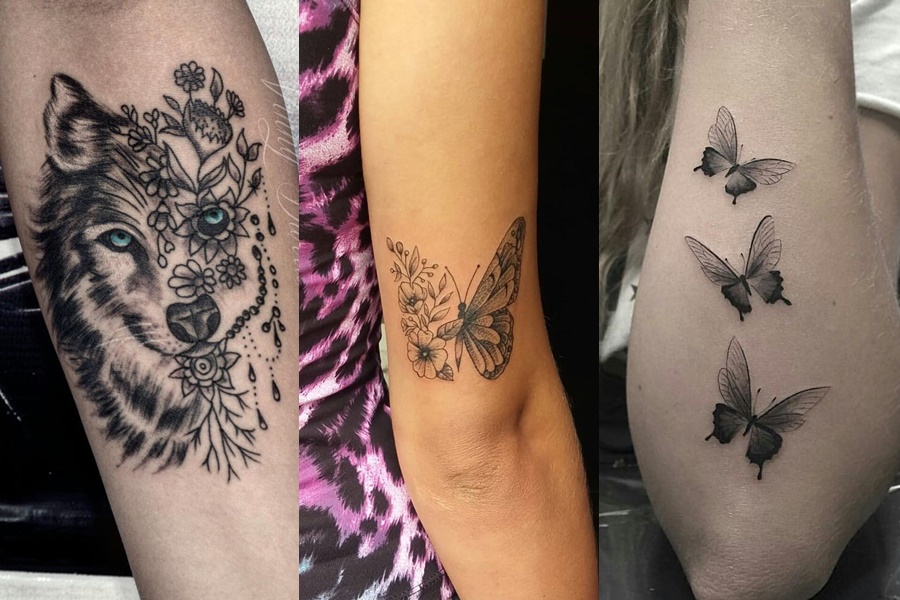 tatuagens femininas de animais no braço ( borboleta e lobo)